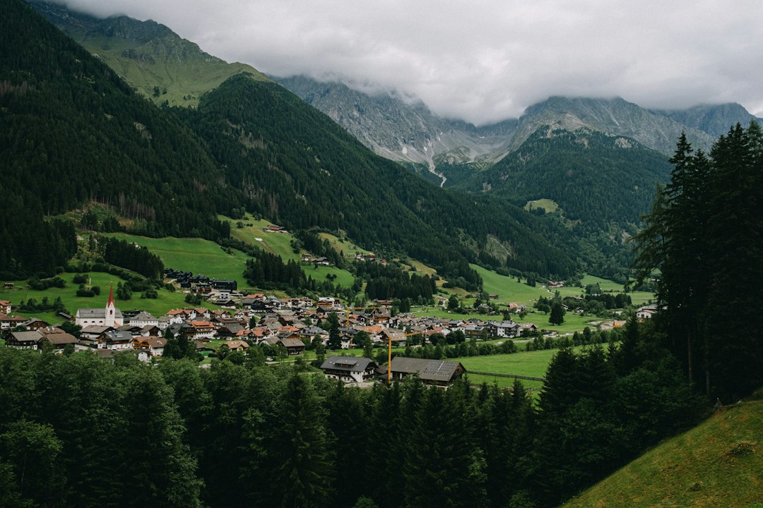 A small village nestled in a green mountain valley